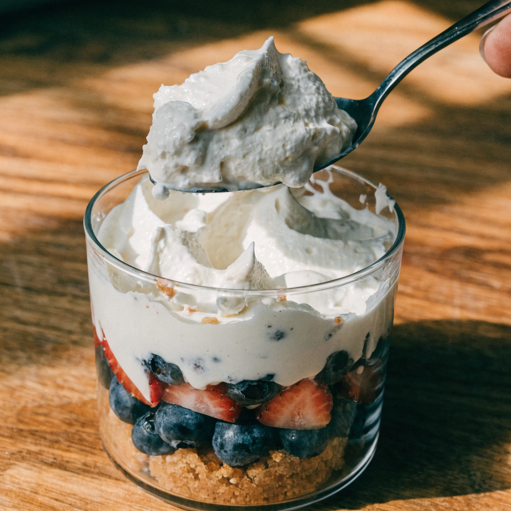 Close-up of red white and blue treats platter: mini parfaits, tartlets, and rice krispie stars