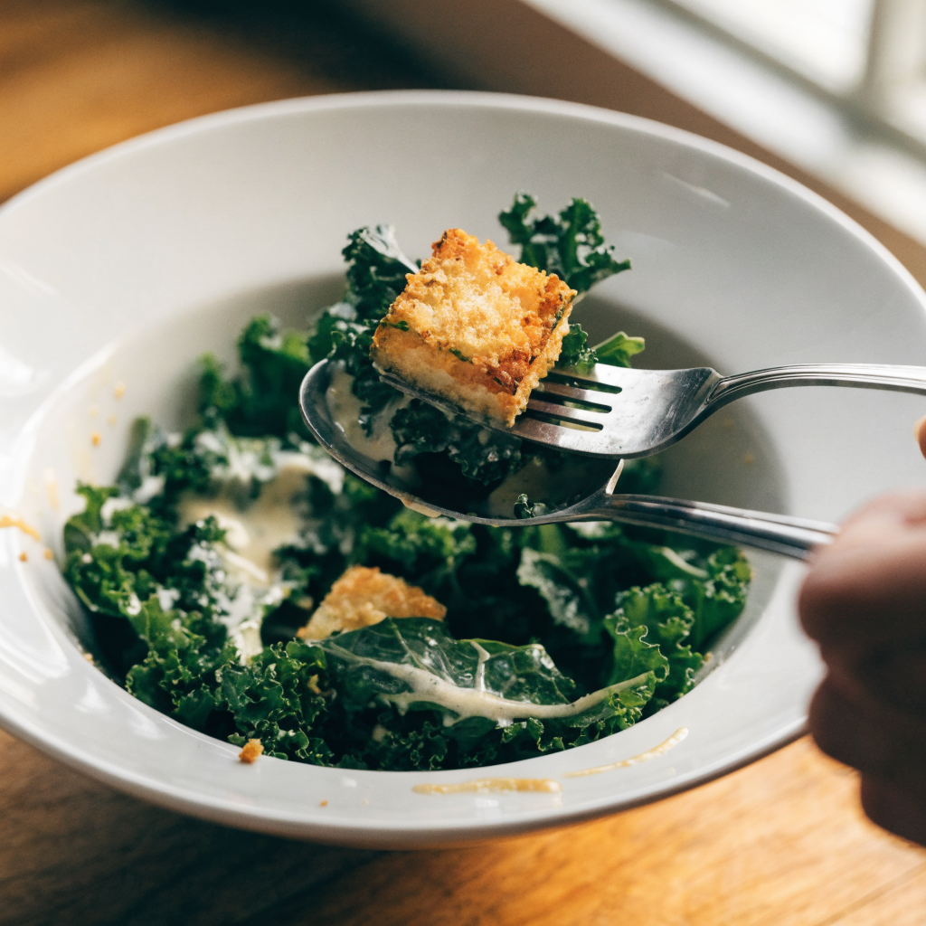 Close-up of autumn caesar salad with delicata squash croutons