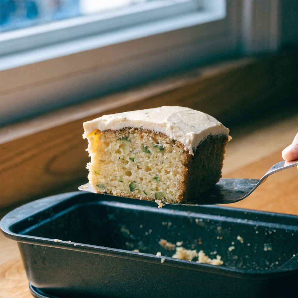 Close-up of simple zucchini cake with cinnamon cream cheese frosting