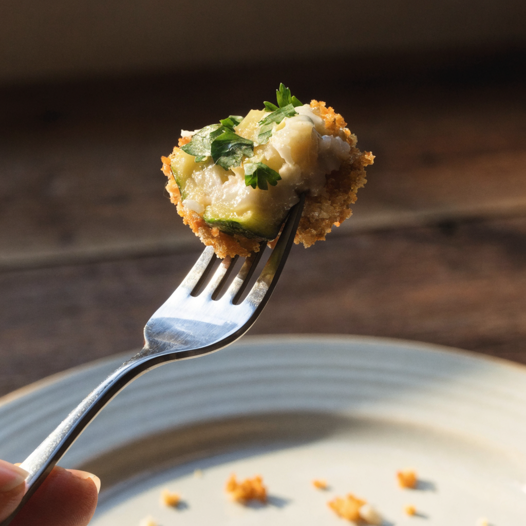 Close-up of zucchini garlic bites with parmesan and herbs